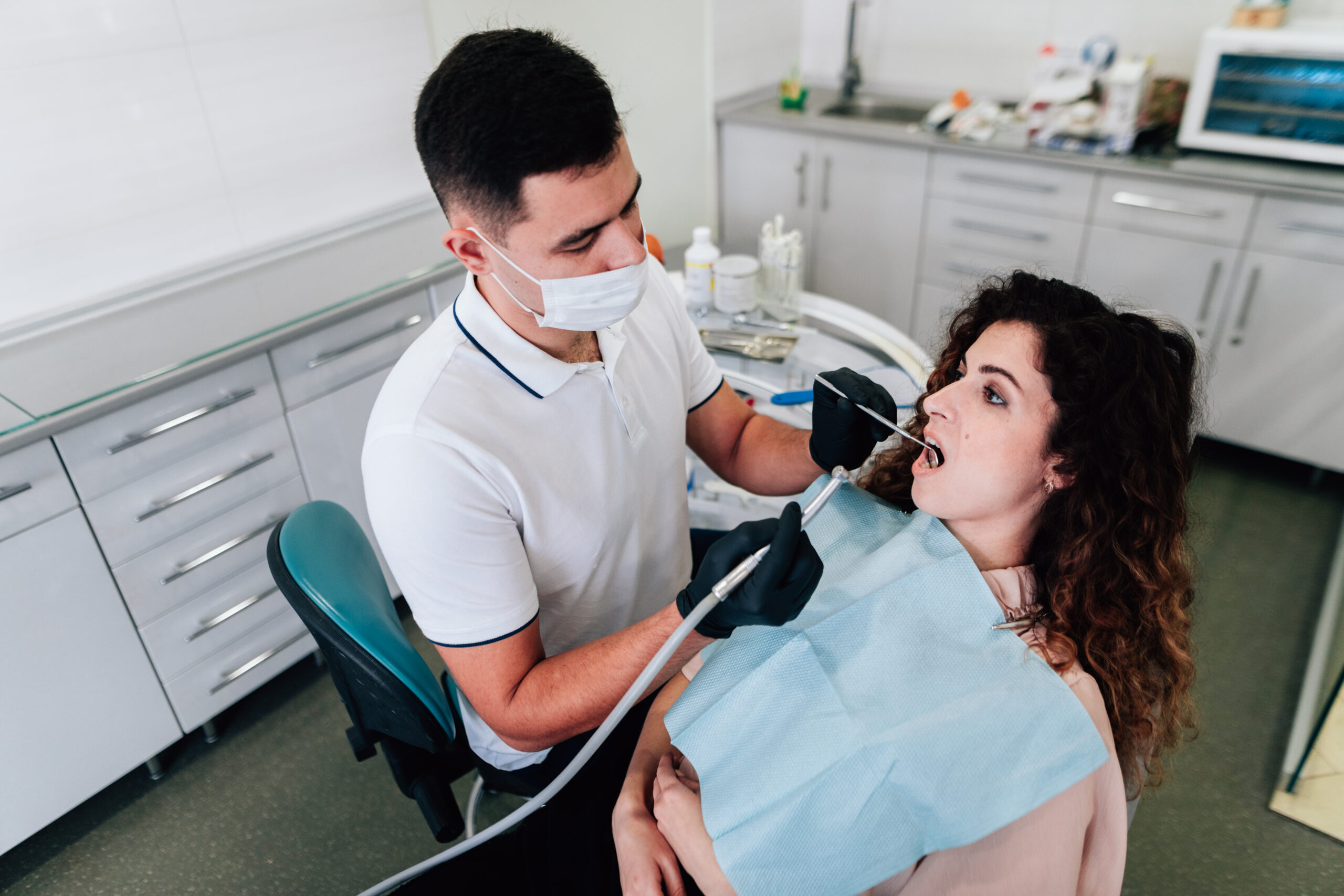 patient getting teeth cleaning at Miro Dental Centers